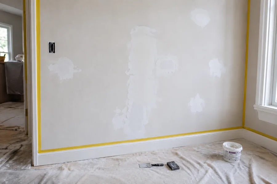 Wall prepared and made ready for painting after wallpaper removal